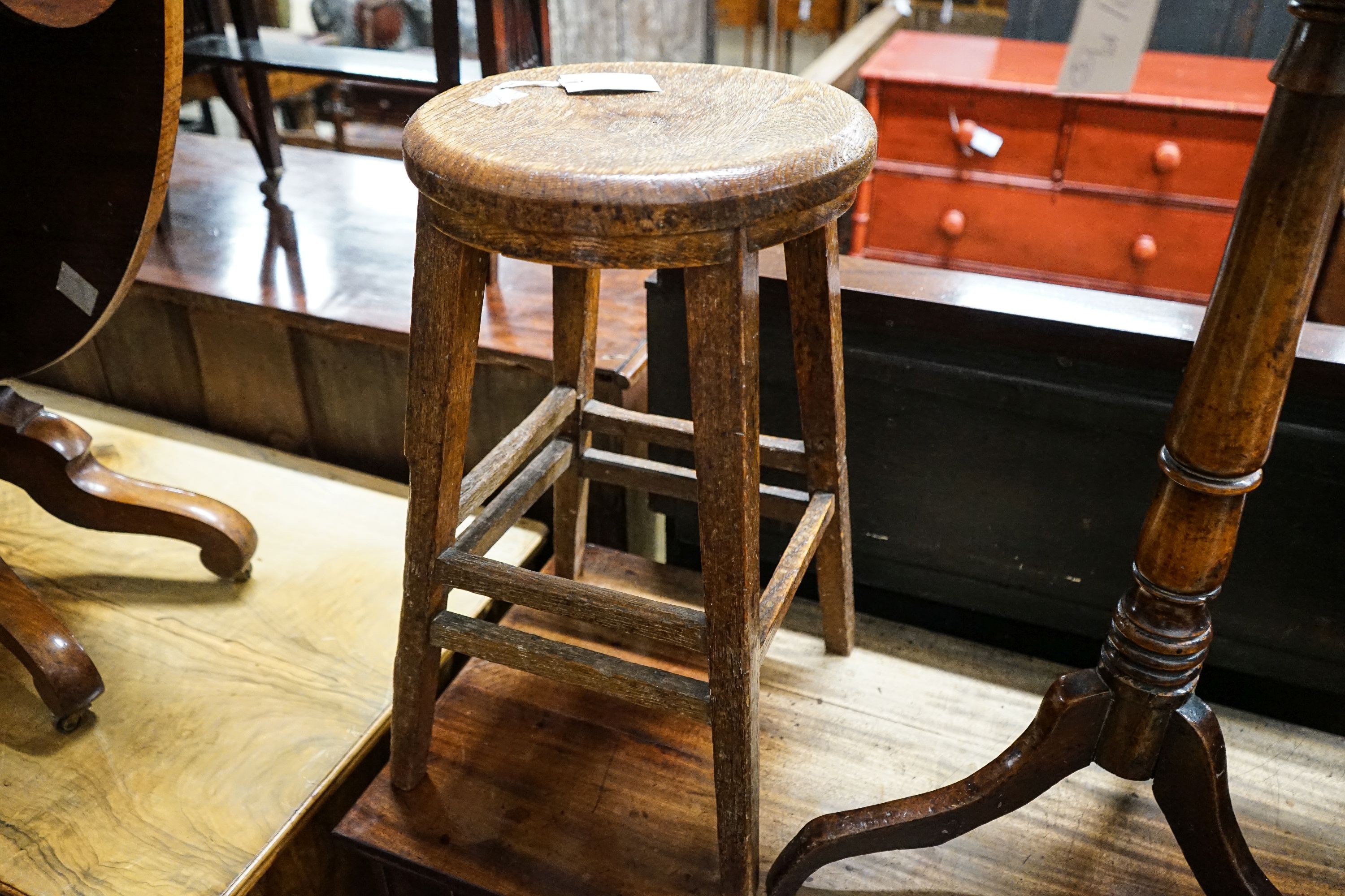 A 19th century circular mahogany tripod wine table, diameter 45cm, height 74cm, together with a nest of tea tables, and a provincial tall oak stool